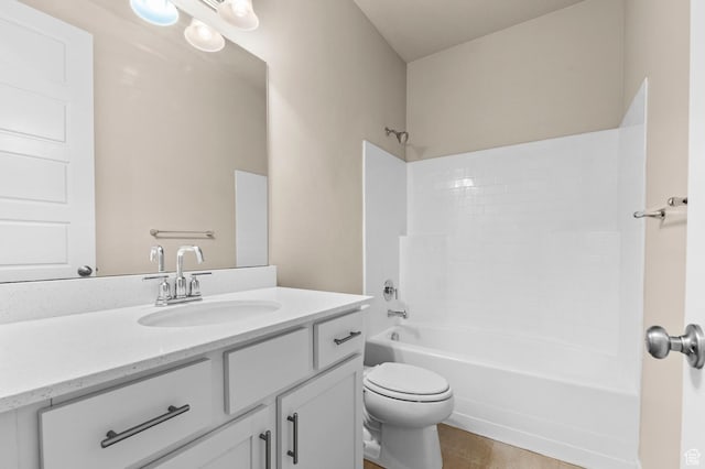bathroom featuring toilet, washtub / shower combination, vanity, and wood finished floors