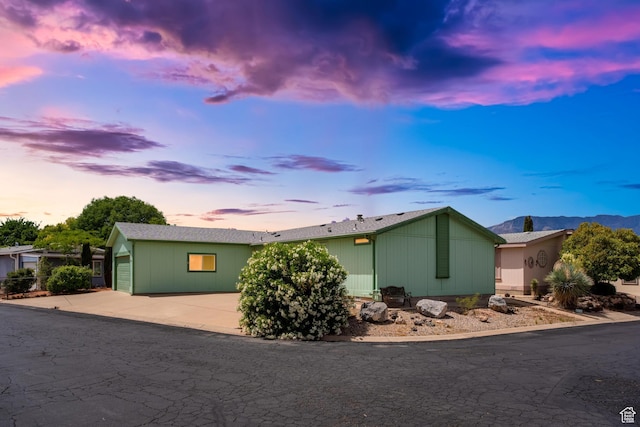 39 N 3850 W, Hurricane, UT 84737 - view of home's exterior with a garage, concrete driveway, and a mountain view
