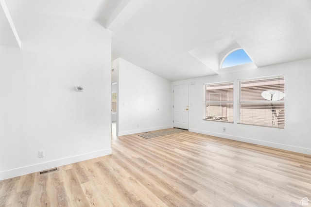 39 N 3850 W, Hurricane, UT 84737 - unfurnished living room featuring lofted ceiling, baseboards, and wood finished floors