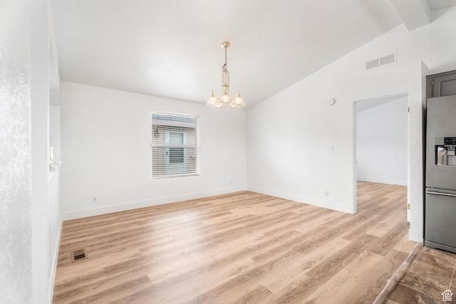 39 N 3850 W, Hurricane, UT 84737 - spare room featuring a chandelier, vaulted ceiling, light wood-style floors, and baseboards