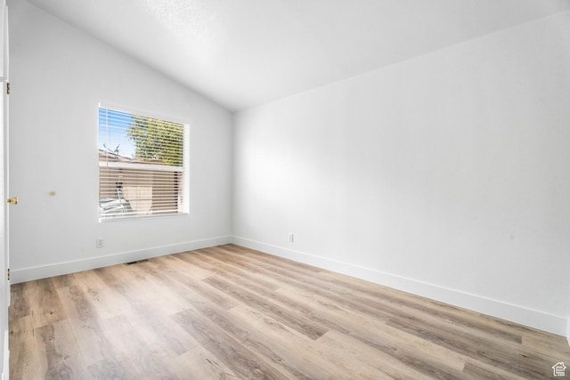 39 N 3850 W, Hurricane, UT 84737 - spare room with lofted ceiling, light wood-type flooring, and baseboards