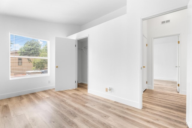 39 N 3850 W, Hurricane, UT 84737 - unfurnished bedroom with light wood finished floors, baseboards, a walk in closet, and a closet