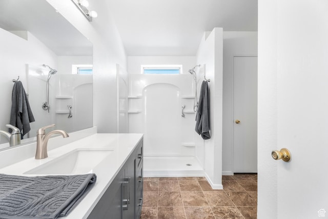 39 N 3850 W, Hurricane, UT 84737 - bathroom with a shower, vanity, and baseboards