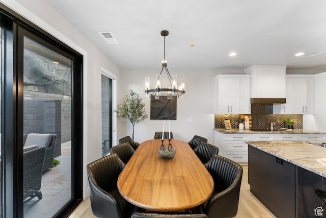 5266 W 2480 S Unit 132, Hurricane, UT 84737 - dining room with light wood-type flooring, a chandelier, and recessed lighting
