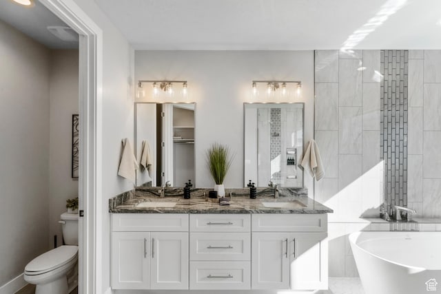 5266 W 2480 S Unit 132, Hurricane, UT 84737 - full bath with toilet, a freestanding tub, double vanity, and a walk in shower