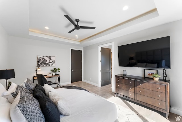 5266 W 2480 S Unit 132, Hurricane, UT 84737 - bedroom with a tray ceiling, light wood-type flooring, recessed lighting, baseboards, and ceiling fan