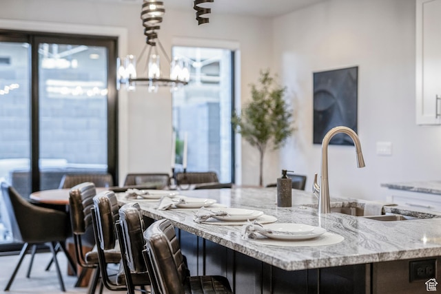 5266 W 2480 S Unit 132, Hurricane, UT 84737 - dining area featuring a chandelier