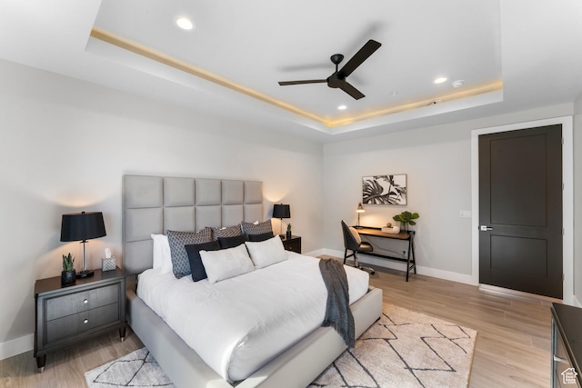 5266 W 2480 S Unit 132, Hurricane, UT 84737 - bedroom featuring a raised ceiling, baseboards, recessed lighting, light wood finished floors, and ceiling fan