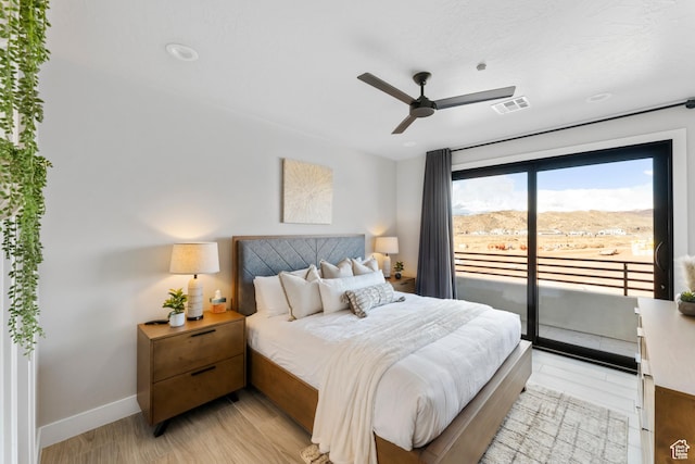 5266 W 2480 S Unit 132, Hurricane, UT 84737 - bedroom with access to outside, light wood finished floors, baseboards, and a ceiling fan