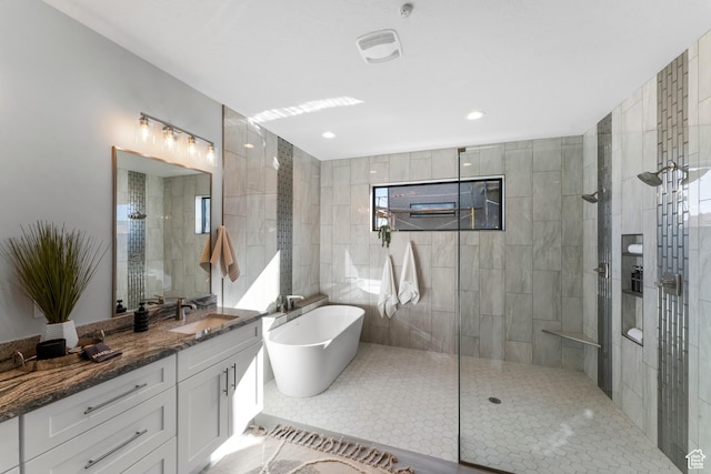 5266 W 2480 S Unit 132, Hurricane, UT 84737 - full bath featuring walk in shower, a freestanding tub, vanity, and tile patterned flooring