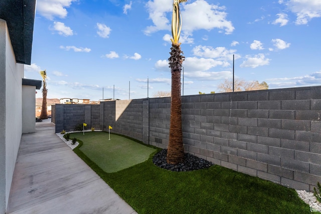 5266 W 2480 S Unit 132, Hurricane, UT 84737 - fenced backyard featuring a putting area
