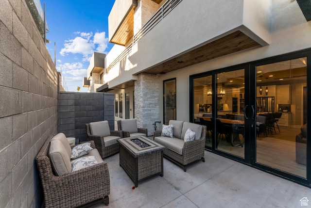 5266 W 2480 S Unit 132, Hurricane, UT 84737 - view of patio / terrace featuring an outdoor living space with a fire pit