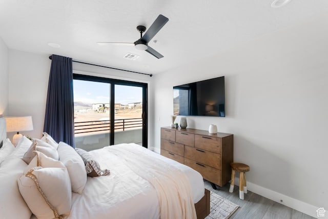 5266 W 2480 S Unit 132, Hurricane, UT 84737 - bedroom with access to outside, baseboards, and a ceiling fan