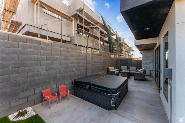5266 W 2480 S Unit 132, Hurricane, UT 84737 - view of patio / terrace with a hot tub, a fenced backyard, and outdoor lounge area