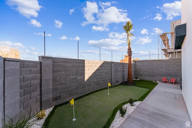 5266 W 2480 S Unit 132, Hurricane, UT 84737 - fenced backyard featuring a putting area