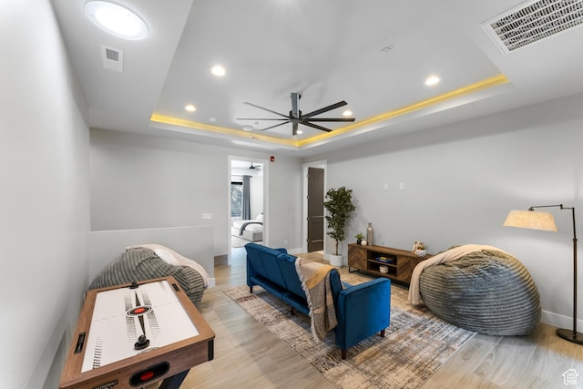 5266 W 2480 S Unit 132, Hurricane, UT 84737 - living room with a raised ceiling, wood finished floors, ceiling fan, recessed lighting, and baseboards