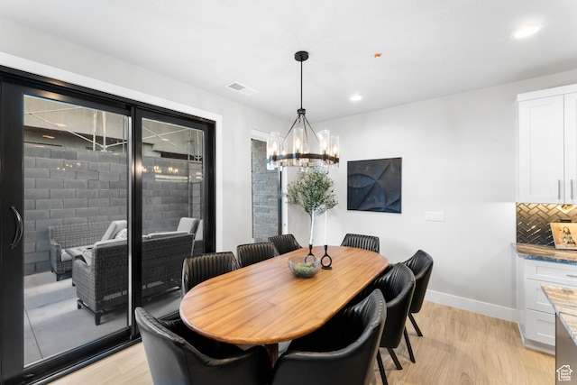 5266 W 2480 S Unit 132, Hurricane, UT 84737 - dining area featuring light wood-style floors, a chandelier, baseboards, and recessed lighting