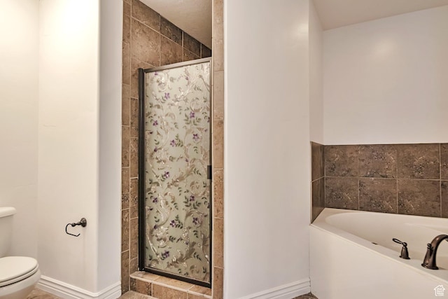 845 S 1840 W, Orem, UT 84059 - bathroom featuring a shower stall, toilet, a garden tub, and baseboards