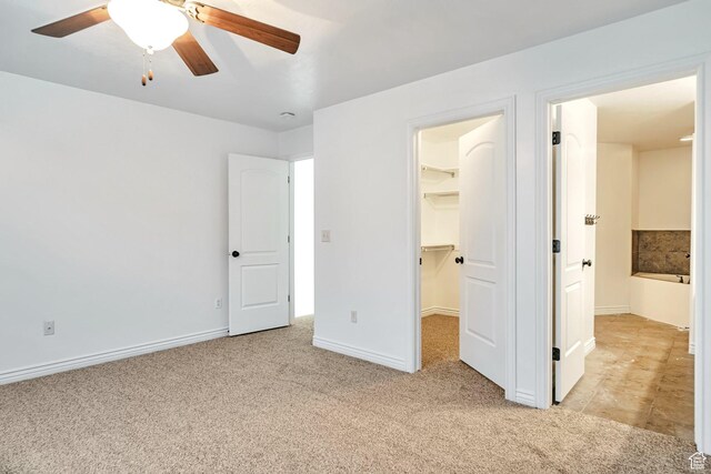 845 S 1840 W, Orem, UT 84059 - unfurnished bedroom with light carpet, a walk in closet, a closet, baseboards, and ceiling fan
