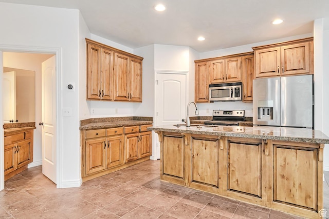 845 S 1840 W, Orem, UT 84059 - kitchen featuring appliances with stainless steel finishes, a sink, an island with sink, light stone counters, and recessed lighting