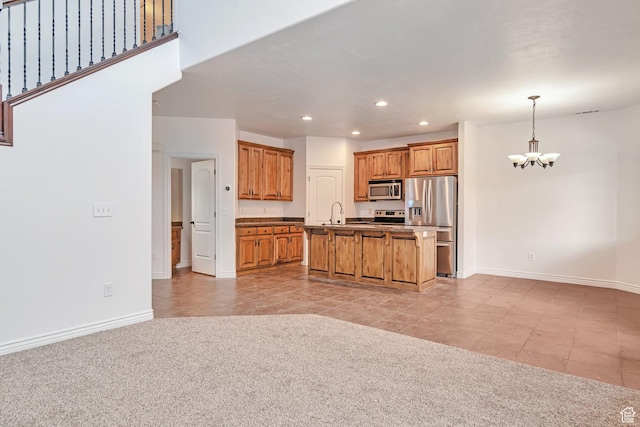 845 S 1840 W, Orem, UT 84059 - kitchen with stainless steel appliances, a chandelier, recessed lighting, baseboards, and brown cabinetry