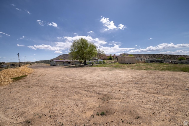 3820 W Main St, Vernal, UT 84078 - view of yard with an outdoor structure, fence, and a storage unit