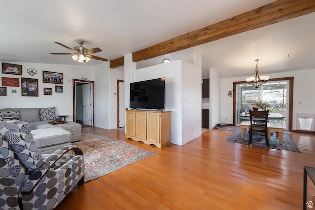 3820 W Main St, Vernal, UT 84078 - living room featuring a chandelier, light wood-style floors, a ceiling fan, and beamed ceiling