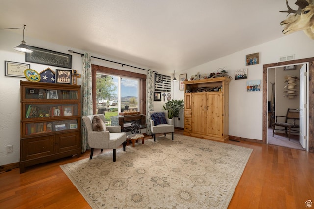 3820 W Main St, Vernal, UT 84078 - living area featuring wood finished floors, lofted ceiling, and baseboards