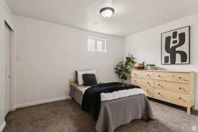 11842 S Elm Ridge Rd E, Sandy, UT 84094 - bedroom featuring dark colored carpet, a textured ceiling, and baseboards