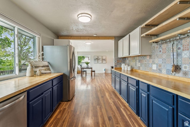 11842 S Elm Ridge Rd E, Sandy, UT 84094 - kitchen with wooden counters, blue cabinetry, stainless steel appliances, and dark wood-style floors