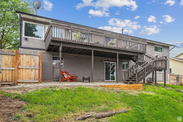 11842 S Elm Ridge Rd E, Sandy, UT 84094 - back of property featuring brick siding, a deck, stairs, and a patio area
