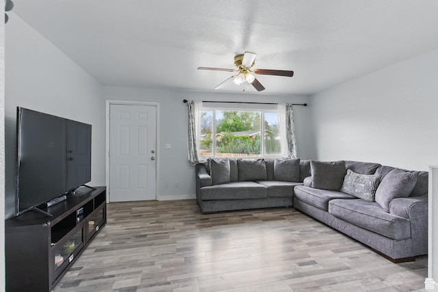 493 N 1025 W St W, Orem, UT 84057 - living area with a ceiling fan, light wood finished floors, and baseboards