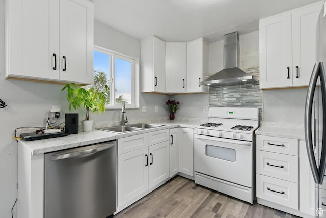 493 N 1025 W St W, Orem, UT 84057 - kitchen with white gas stove, dishwasher, wall chimney range hood, a sink, and white cabinets