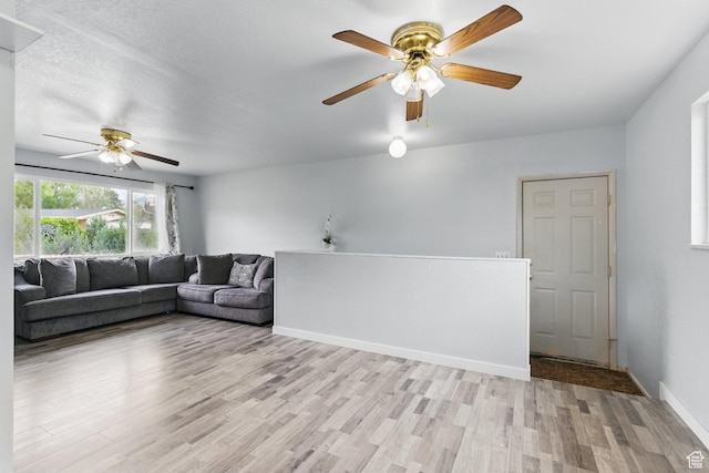 493 N 1025 W St W, Orem, UT 84057 - living area with ceiling fan, light wood-style floors, and baseboards