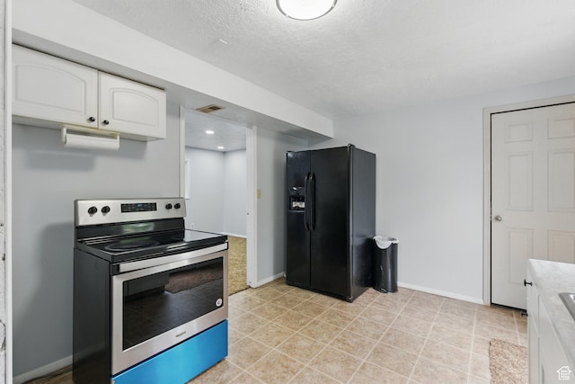 493 N 1025 W St W, Orem, UT 84057 - kitchen with stainless steel electric range, black refrigerator with ice dispenser, white cabinets, light countertops, and baseboards
