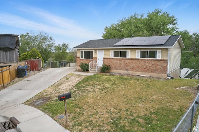 493 N 1025 W St W, Orem, UT 84057 - ranch-style home with brick siding, solar panels, and driveway