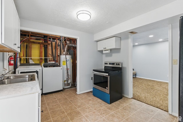 493 N 1025 W St W, Orem, UT 84057 - kitchen with stainless steel electric stove, gas water heater, washer and clothes dryer, white cabinets, and a sink