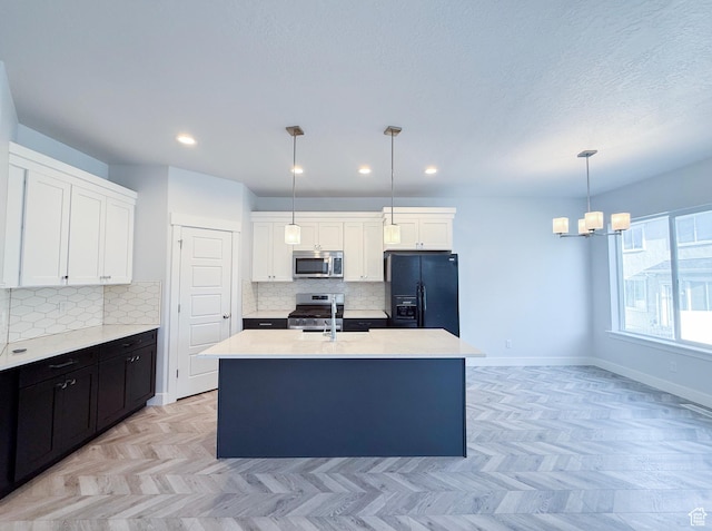 5107 W Harlow Way, Herriman, UT 84096 - kitchen featuring stainless steel appliances, tasteful backsplash, a sink, white cabinetry, and recessed lighting