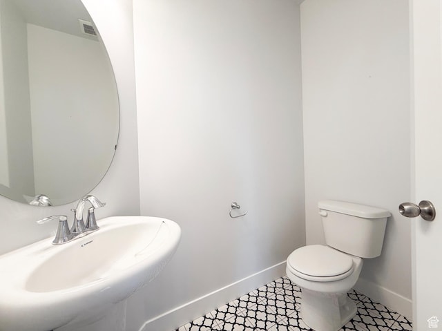 5107 W Harlow Way, Herriman, UT 84096 - bathroom with baseboards, a sink, toilet, and tile patterned flooring