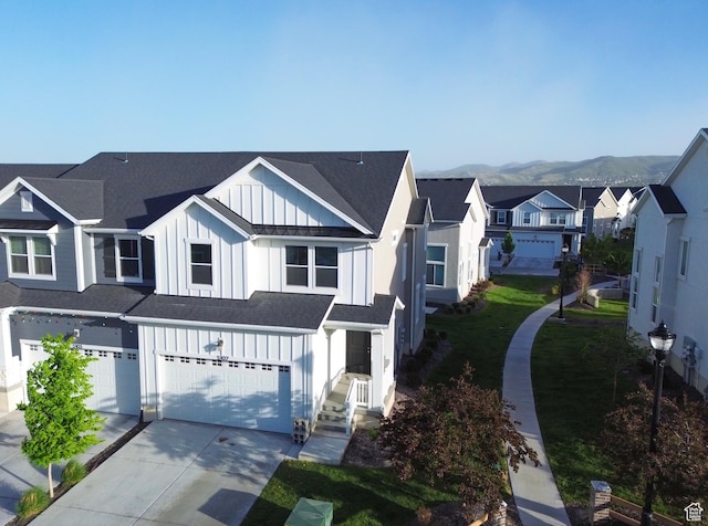 5107 W Harlow Way, Herriman, UT 84096 - view of front of property with board and batten siding, an attached garage, a residential view, concrete driveway, and a shingled roof