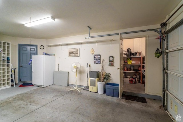 garage with freestanding refrigerator