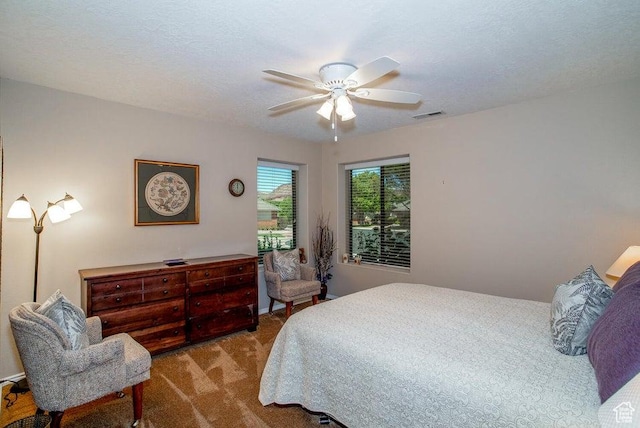 bedroom with carpet and a ceiling fan