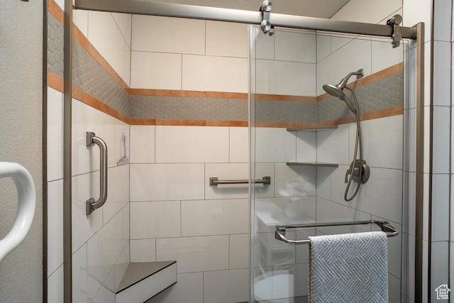 full bath with a shower stall