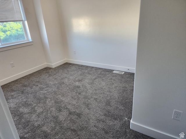 314 E 38th St, South Ogden, UT 84405 - spare room with dark carpet and baseboards