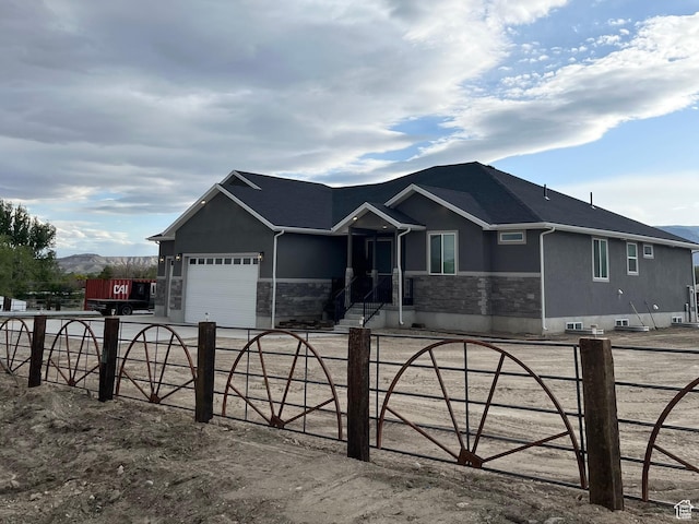 365 N 100 E, Ferron, UT 84523 - ranch-style home featuring stucco siding, a garage, and stone siding