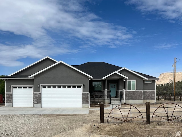 365 N 100 E, Ferron, UT 84523 - view of front of home with stone siding, stucco siding, and driveway