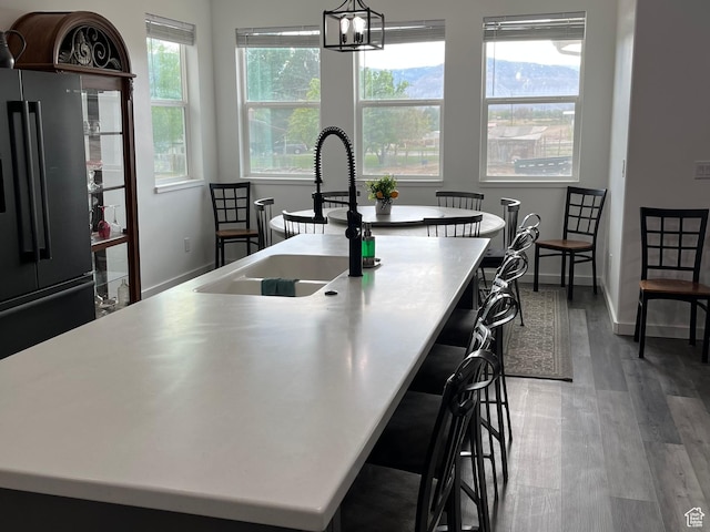 365 N 100 E, Ferron, UT 84523 - kitchen with a sink, freestanding refrigerator, an island with sink, and healthy amount of natural light