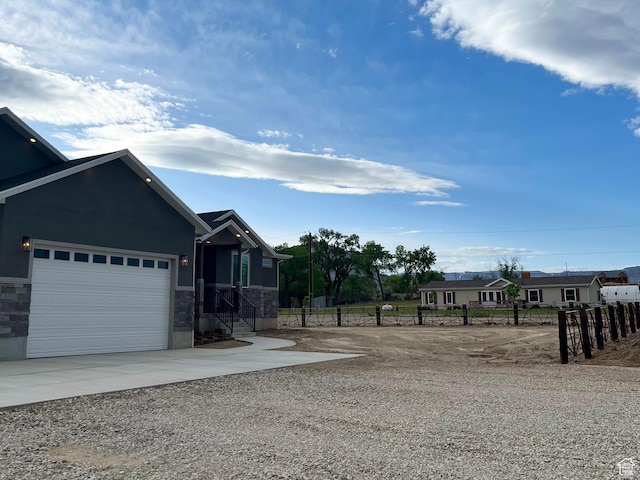 365 N 100 E, Ferron, UT 84523 - view of yard with driveway, fence, and an attached garage