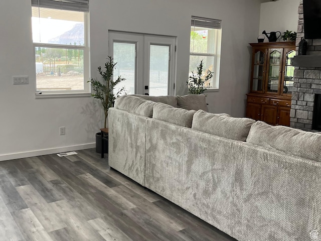 365 N 100 E, Ferron, UT 84523 - living room featuring a fireplace, wood finished floors, healthy amount of natural light, and baseboards