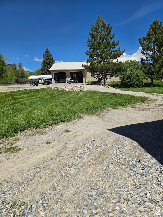 5654 E Cub Rd, Preston, ID 83263 - view of front facade with driveway, an attached garage, and a front yard